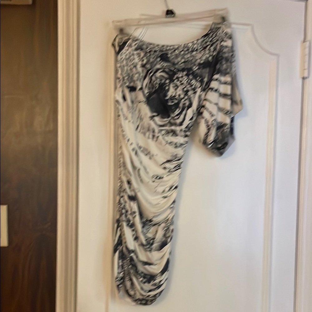 Elegant Black and White Women's top.  Stretchy, body hugging,  cold shoulder.